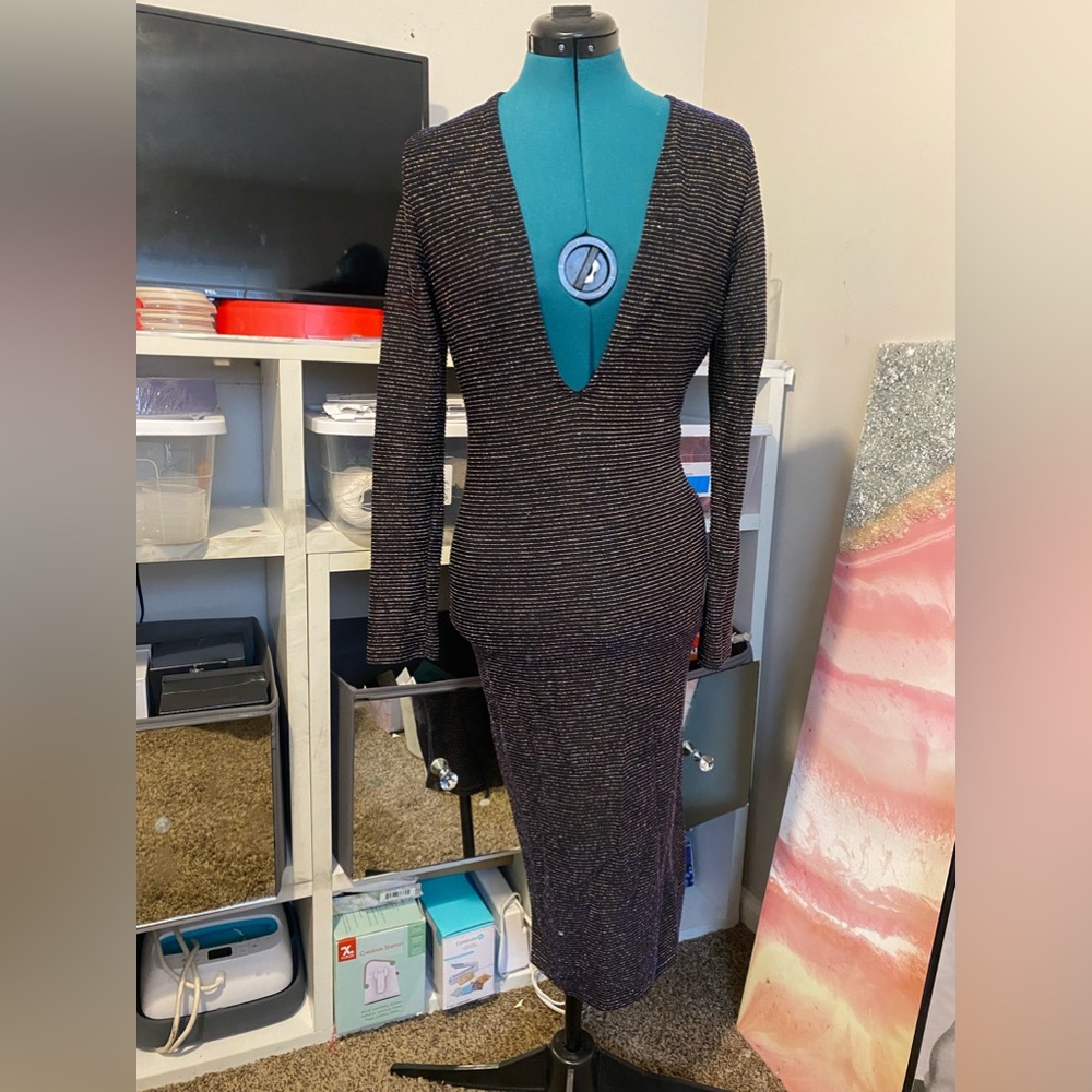 Large Deep V long sleeve black glitter dress.